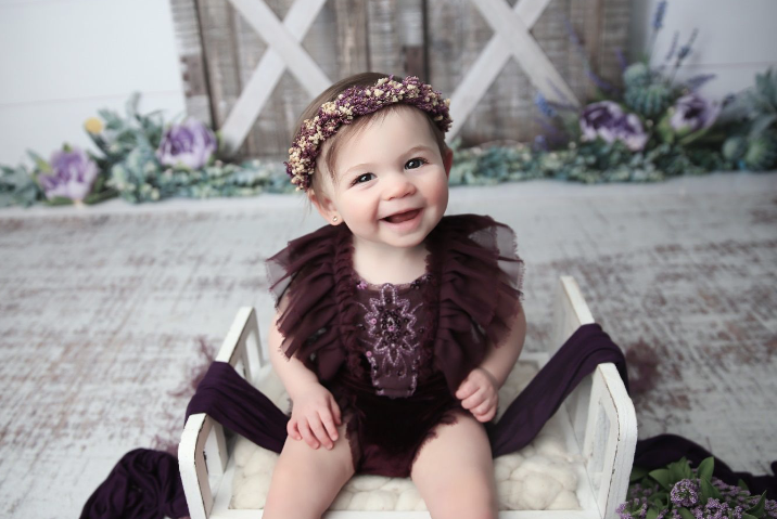Cake Smash Photographer — Grove City, Ohio 2 Little girl in maroon with flower headband in chair